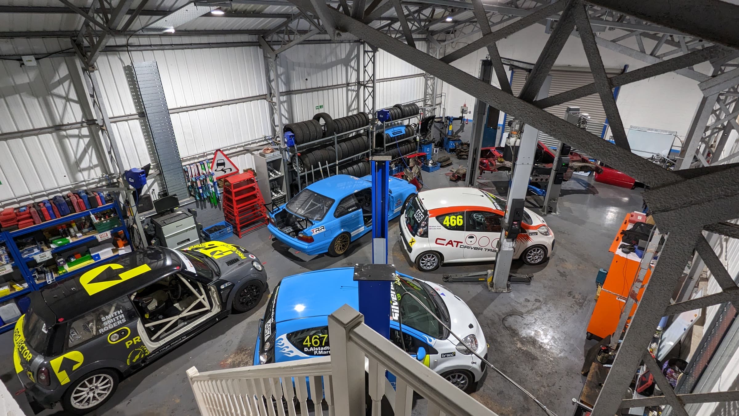 The TTR workshop from the stairs: race cars on the ramps